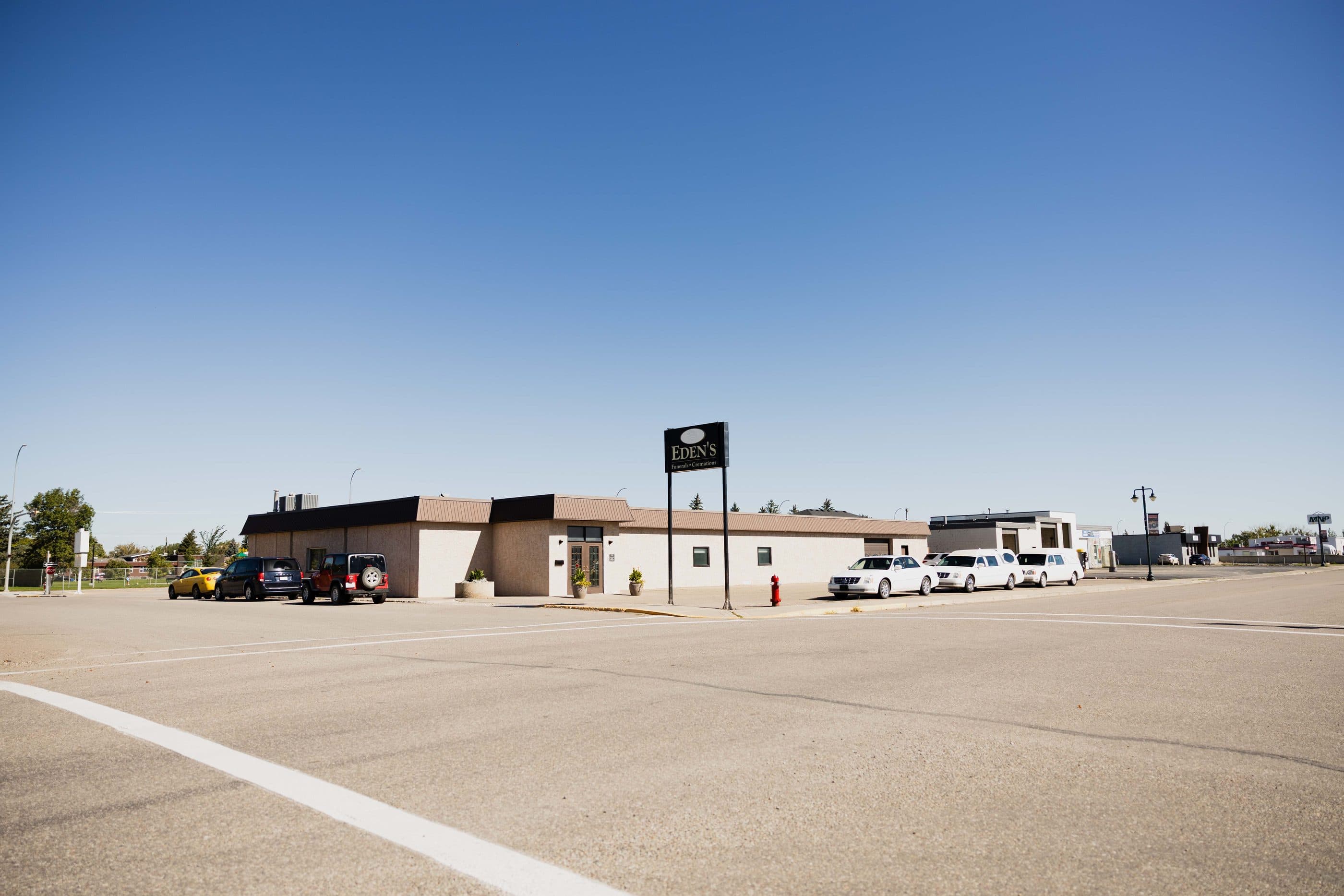The Eden's Funeral Home building under a clear blue sky