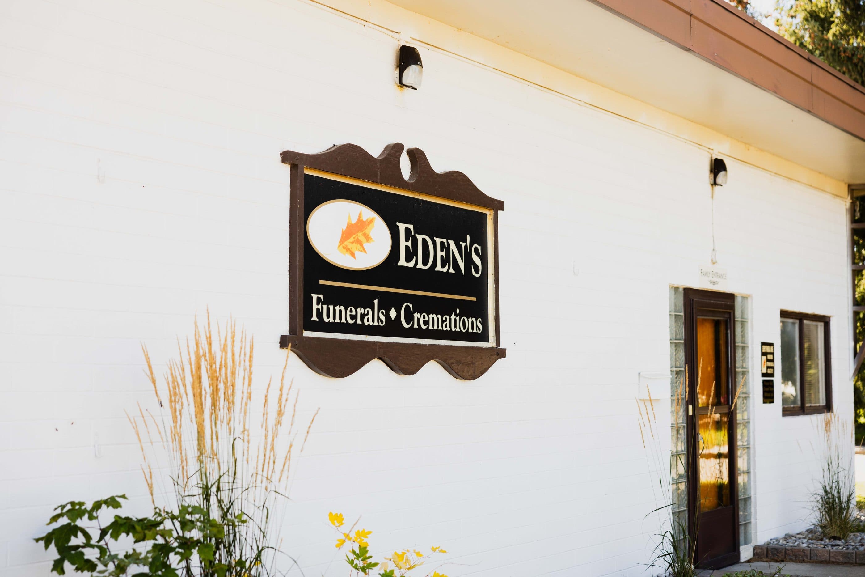 The Eden's Funerals & Cremations sign on the chapel wall