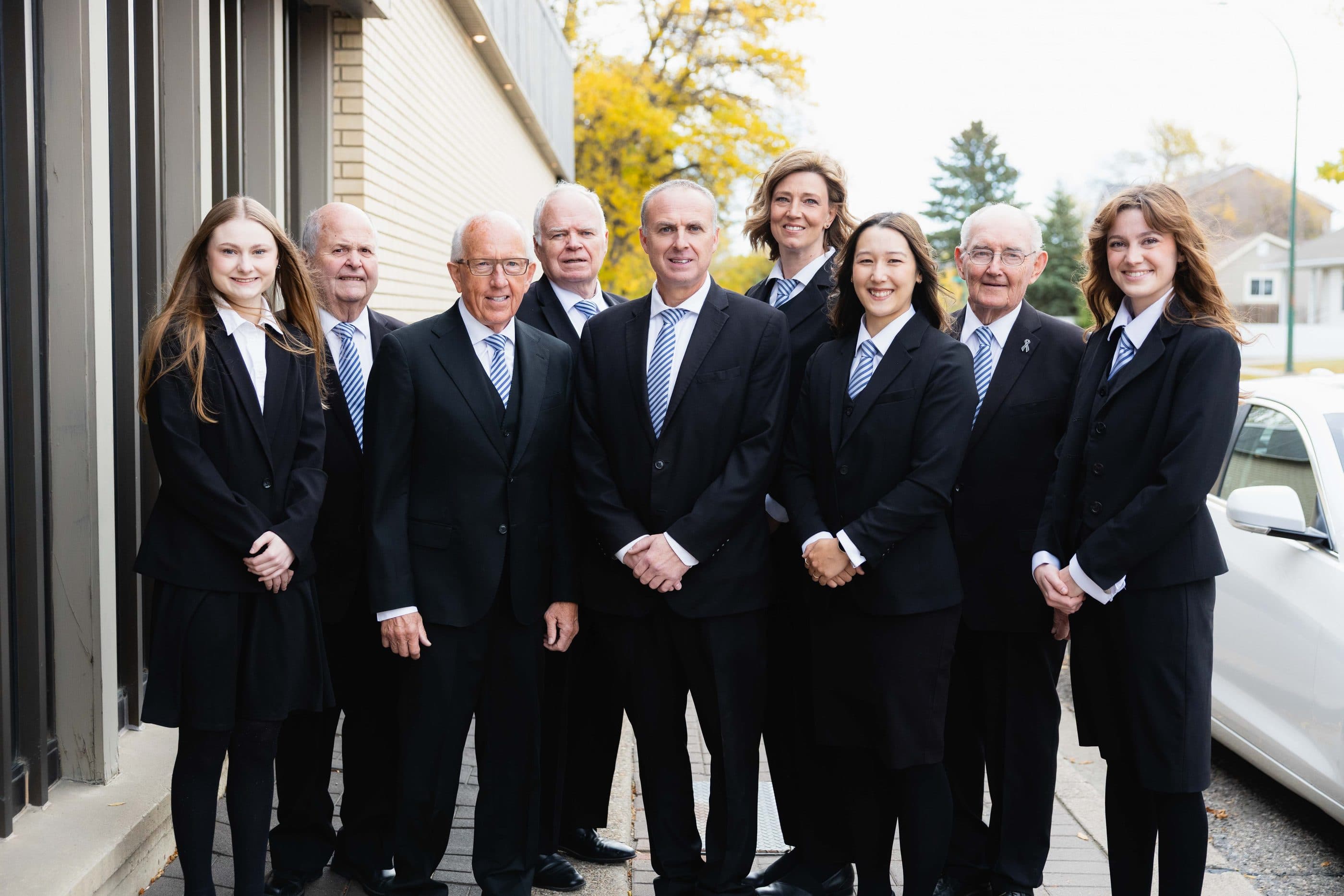 The Christensen Salmon Generations team standing together outside the funeral home