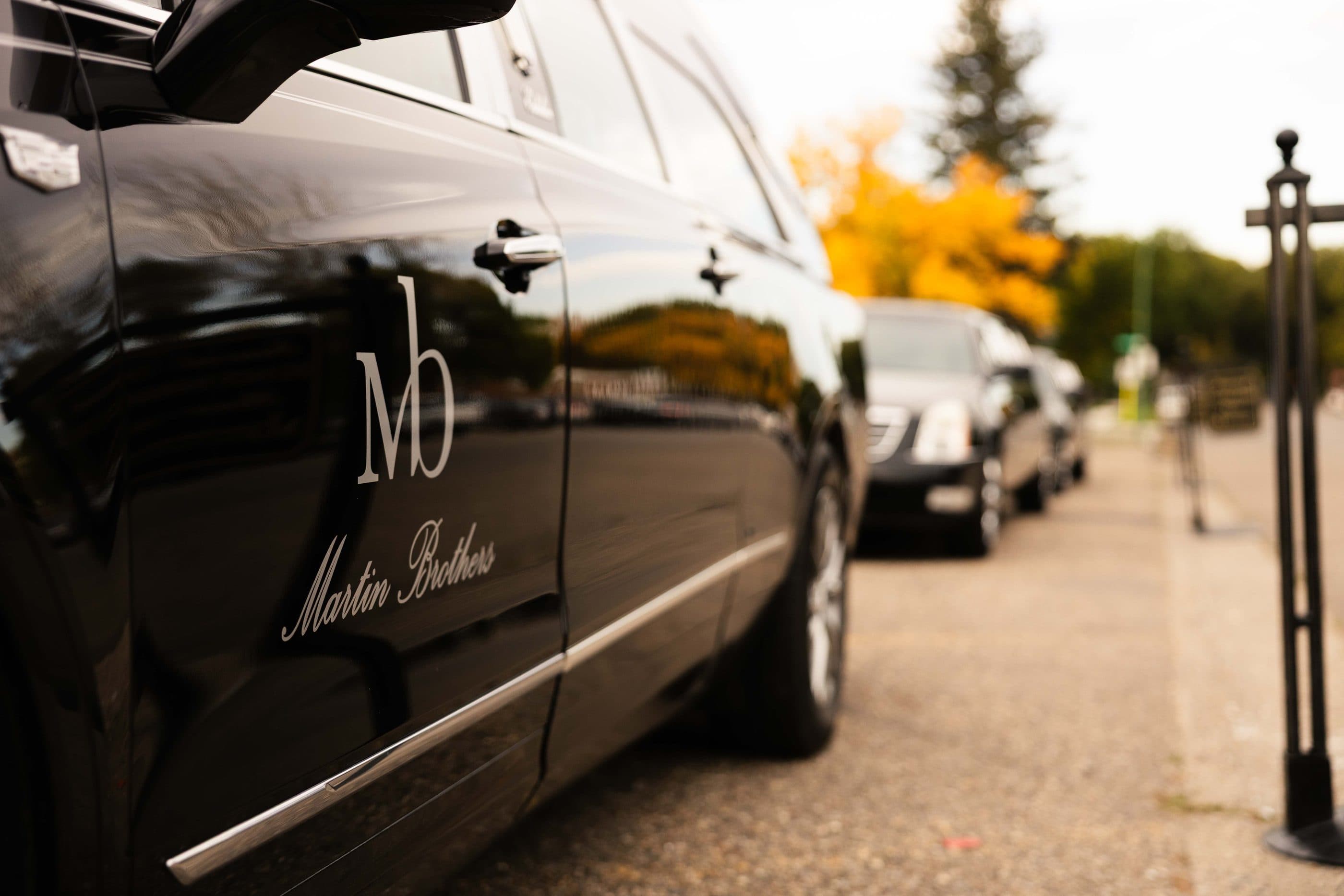 The Martin Brothers monogram on the side of a hearse