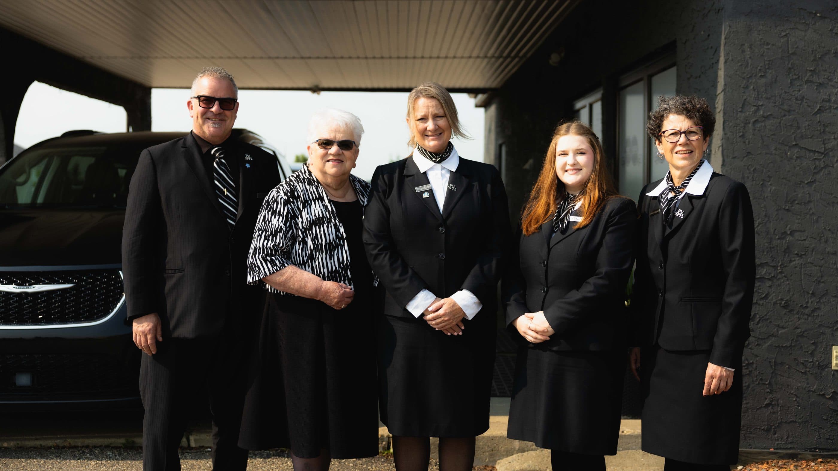 The Parkview Stettler team standing together outside the funeral home